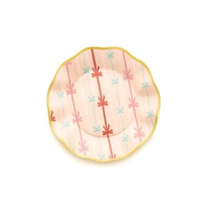 May include: A decorative plate with a scalloped edge and a gold rim. The plate features a pink background with vertical stripes and a pattern of bows in red, pink, and light blue.