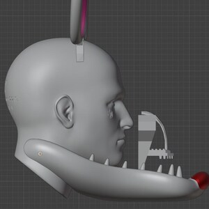 May include: A 3D rendering of a gray human head with a jaw-like structure and a red tip. A gray and pink bunny ear is attached to the head. A mechanical structure is positioned near the face.