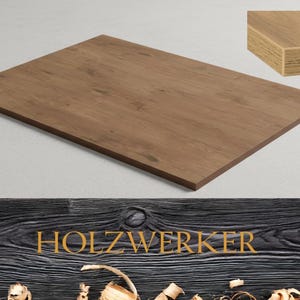 May include: A rectangular wooden tabletop with a brown finish. The wood grain is visible, and the edges are a darker brown. The word "HOLZWERKER" is displayed in gold lettering on a dark wood background.
