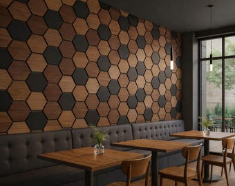 May include: A restaurant interior featuring a wall decorated with a pattern of wooden and black hexagonal tiles. The space includes wooden tables, chairs, and a built-in bench with a dark gray upholstered back. The room is illuminated by hanging lights.