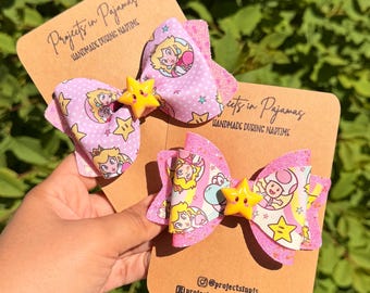Lazo para el cabello de la Princesa Melocotón, accesorio para gamers con purpurina rosa, ideal para fiestas temáticas de videojuegos, con broche decorado con estrellas.