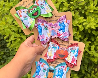 Lazos para el cabello de los monstruos del vecindario: verdes, rojos, azules o morados.