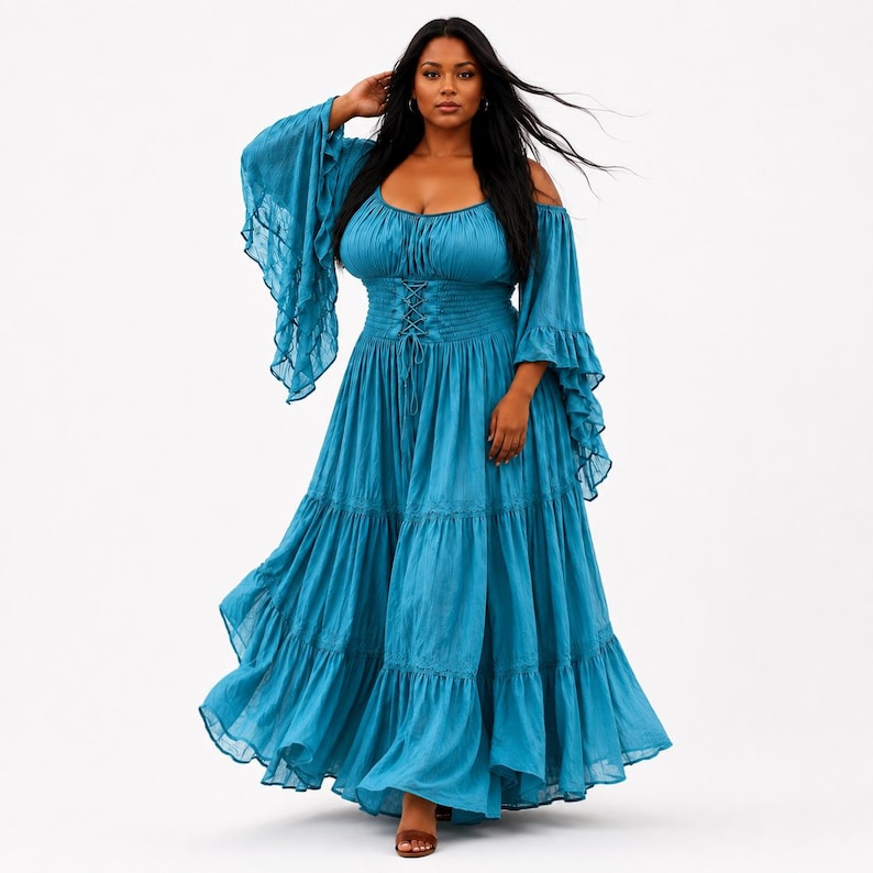 May include: A floor-length teal maxi dress featuring an off-the-shoulder neckline, long flared bell sleeves, and a corset-style lace-up bodice with a smocked waist. The skirt is designed with multiple tiered layers, creating a full, flowing silhouette.
