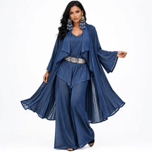 May include: A dark blue three-piece outfit consisting of a sleeveless top, wide-leg trousers, and a long, flowing open-front duster cardigan. The ensemble is accented with a wide, metallic silver-toned belt featuring an ornate, rectangular buckle.