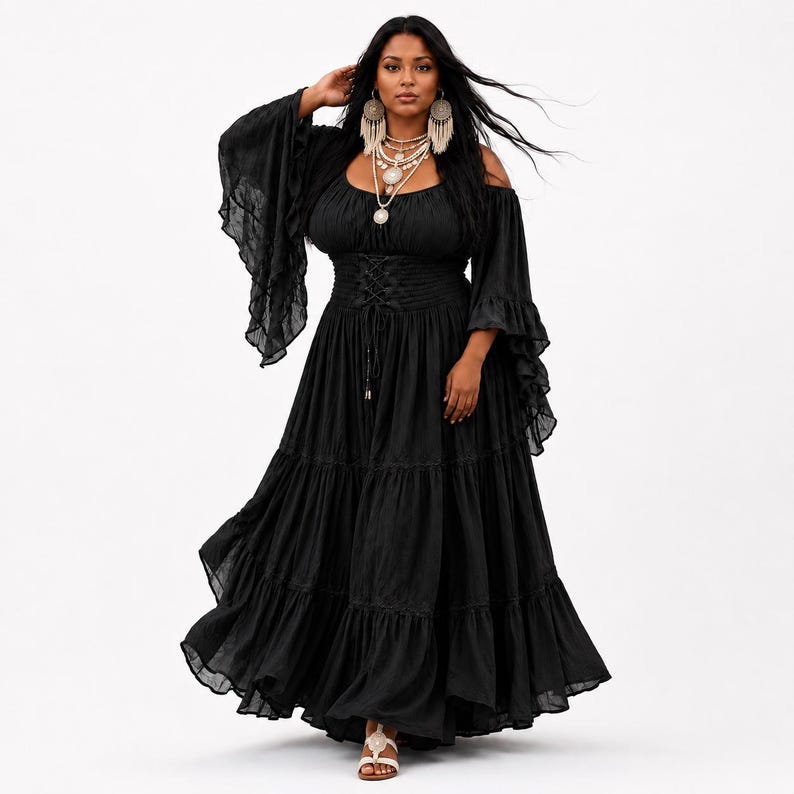 May include: A black maxi dress featuring an off-the-shoulder neckline, long flared bell sleeves with ruffled edges, and a corset-style lace-up bodice. The skirt is floor-length with tiered layers and a ruffled hem, crafted from a lightweight fabric.