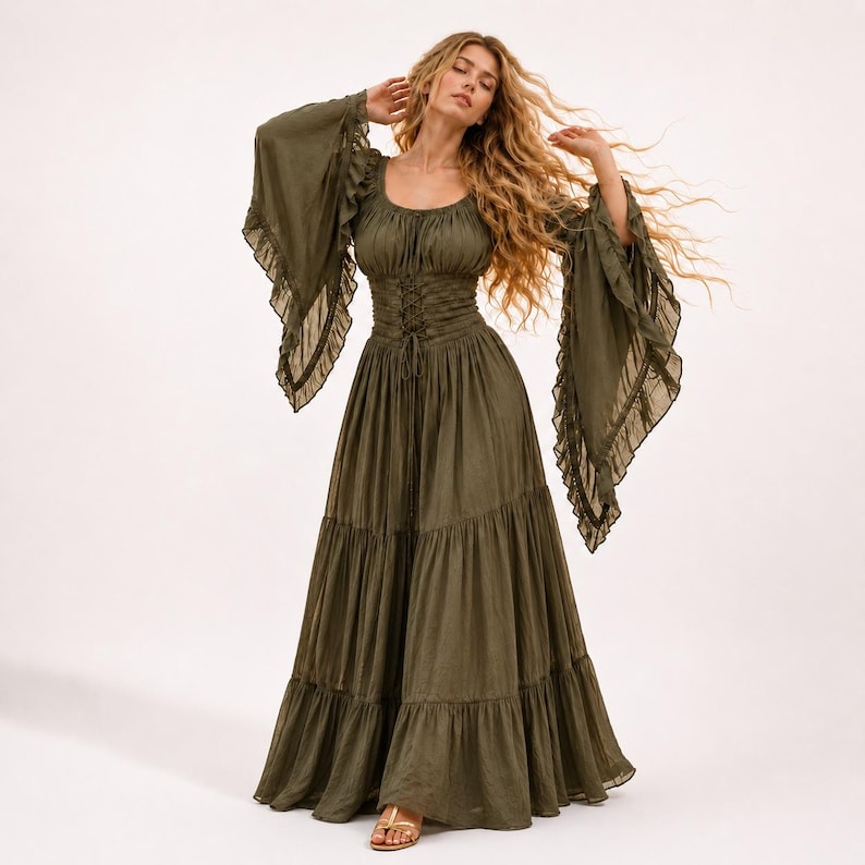 May include: An olive green floor-length dress featuring a scoop neckline, long flared bell sleeves with ruffled edges, and a corset-style lace-up bodice. The skirt is designed with multiple horizontal tiers, creating a full, flowing silhouette.