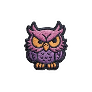 May include: Embroidered owl patch in shades of purple, pink, orange, and black. The owl has large orange eyes and a stern expression. The patch is likely for clothing or accessories.