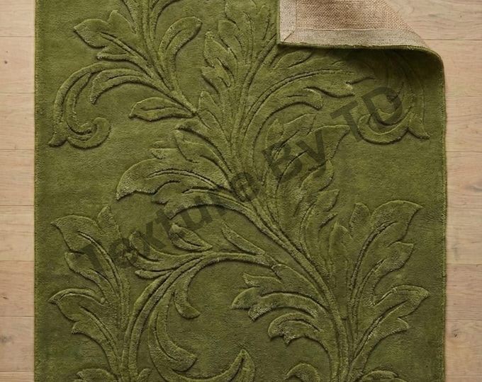 Hand-Tufted green modern rug with a textured floral pattern.