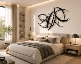 May include: A large black metal wall sculpture featuring an abstract design of intersecting curved lines and crescent shapes mounted on a plain wall above a bed. The piece consists of multiple thin, dark, sweeping arcs that create a dynamic pattern.
