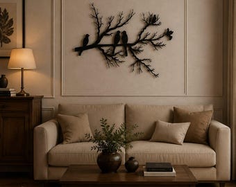 May include: A black metal wall art piece featuring a detailed silhouette of a tree branch with several birds perched along it. The branch has multiple twigs and stems extending outward, creating a natural, organic shape mounted on a wall.