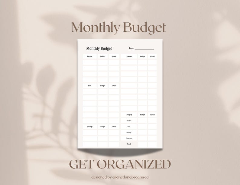 May include: A white monthly budget planner with a grid layout for tracking income, expenses, and savings. The words "Monthly Budget" and "Get Organized" are displayed in a soft brown font. The planner is designed by alignedandorganised.