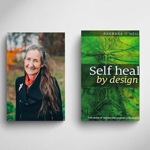 May include: A book cover with the title "Self heal by design" in white and yellow text on a green background. The author's name, Barbara O'Neil, is at the top. Next to the book is a portrait of a woman with long gray hair, wearing a black coat.