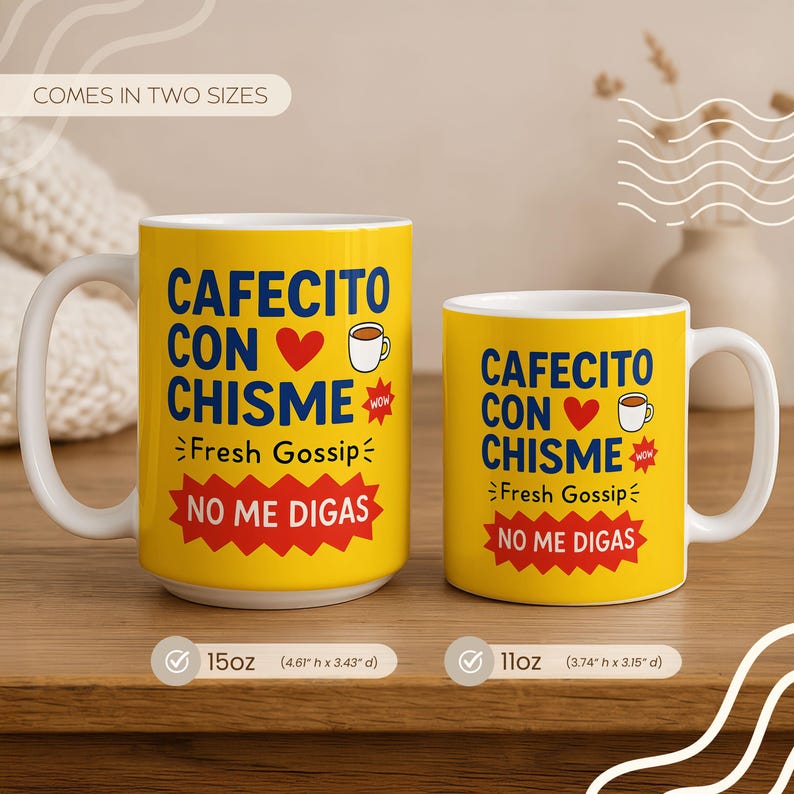 May include: Two yellow coffee mugs with white handles. The mugs have the text "CAFECITO CON CHISME" with a heart and coffee cup graphic. The text "Fresh Gossip" and "NO ME DIGAS" are also on the mugs. One mug is 15oz (4.61" h x 3.43" d), the other is 11oz (3.74" h x 3.15" d).