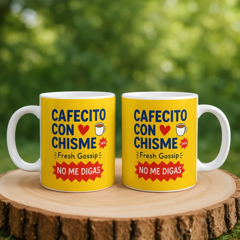 May include: Two yellow coffee mugs with white handles. Each mug has the text "CAFECITO CON CHISME" in blue, with a red heart and coffee cup graphic. Below it says "Fresh Gossip" and "NO ME DIGAS" in red.