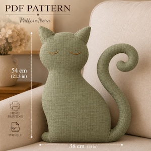 May include: A sage green cat-shaped cushion with embroidered closed eyes and a curved tail. The text reads PDF PATTERN, PatternNora, HOME PRINTING, and PDF FILE. Dimensions are 54 cm in height and 38 cm in width as indicated by the labels.