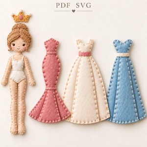 May include: A felt paper doll with brown hair and a gold crown, accompanied by three separate felt dresses in dusty rose, cream, and light blue. Each item features visible white stitched edges. The text PDF SVG is centered at the top.