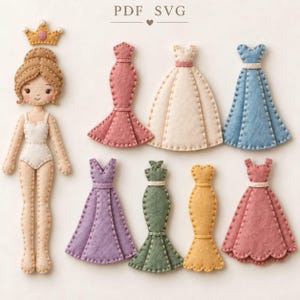 May include: A felt paper doll set featuring a figure with brown hair and a crown, accompanied by seven distinct dresses in various colours including pink, cream, blue, purple, green, yellow, and rose, all with visible stitched edge detailing.