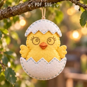 May include: A yellow felt chick ornament emerging from a white cracked eggshell, featuring stitched details, an orange beak, and a hanging string. The text "PDF SVG" is visible at the top of the image, centred above the hanging ornament.