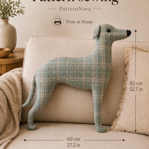 May include: A fabric dog-shaped pillow featuring a light blue and beige plaid pattern with a black nose and eye. The text reads Pattern sewing, PatternNora, and Print at Home. Dimensions are 32.7 inches in height and 27.2 inches in length.