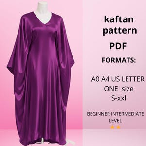 May include: A vibrant purple satin kaftan dress on a mannequin. The dress features a V-neck and flowing sleeves. Text on the right side reads "kaftan pattern PDF FORMATS: A0 A4 US LETTER ONE size S-xxl BEGINNER INTERMEDIATE LEVEL".