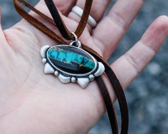 Bao Canyon oval turquoise pendant with sterling silver repousse and strung on genuine high grade adjustable leather strap