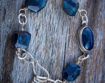 Blue kyanite faceted beaded chain bracelet with a set kyanite and a northern star charm sterling silver