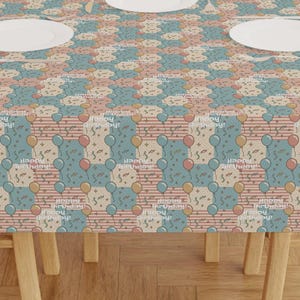 May include: A set of three ceramic mugs with a speckled, matte finish. The mugs are in shades of cream, light brown, and dark brown. Each mug has a simple, minimalist design, perfect for coffee or tea.