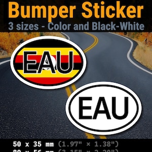 Op de afbeelding: Twee ovale bumperstickers met de tekst EAU. Eén sticker heeft de horizontale zwarte, gele en rode strepen van de Oegandese vlag. De andere is wit met zwarte tekst. Verkrijgbaar in de maten 50 x 35 mm, 80 x 56 mm en 100 x 70 mm.