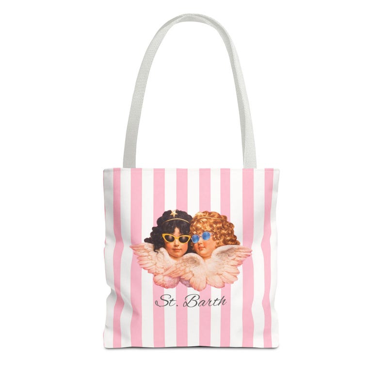 White tote bag with pink vertical stripes and white handles, featuring an illustration of two cherubs wearing sunglasses and the text “St. Barth” printed below them.
