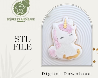May include: A white unicorn cookie with pink and gold accents sits on a white plate. The image includes the text "STL FILE" and "Digital Download". The logo for "3D Press and Bake" is in the upper left corner.