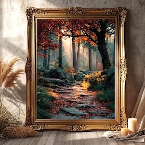 May include: A framed landscape art print featuring a forest scene with a stone path. The artwork is set in a gold ornate frame. The forest has a path with red and orange leaves, and the sun is shining through the trees.