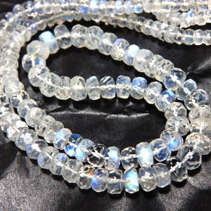 May include: A set of three ceramic nesting bowls in graduating sizes. The bowls are white with a speckled, textured finish and a slightly flared rim. The largest bowl measures approximately 8 inches in diameter.