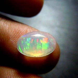 AAA etiopisk opal cabochon 9 x 11 mm oval – prålig naturlig Welo-opal ädelsten för ringinfattning bild 1