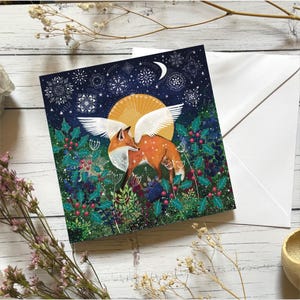 Tarjeta de felicitación de invierno con un ángel zorro