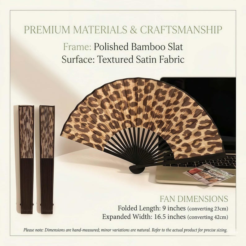 May include: A decorative hand fan with a leopard print design. The fan is made of polished bamboo and textured satin fabric. Folded length is 23cm, expanded width is 42cm. The image also shows two folded fans.