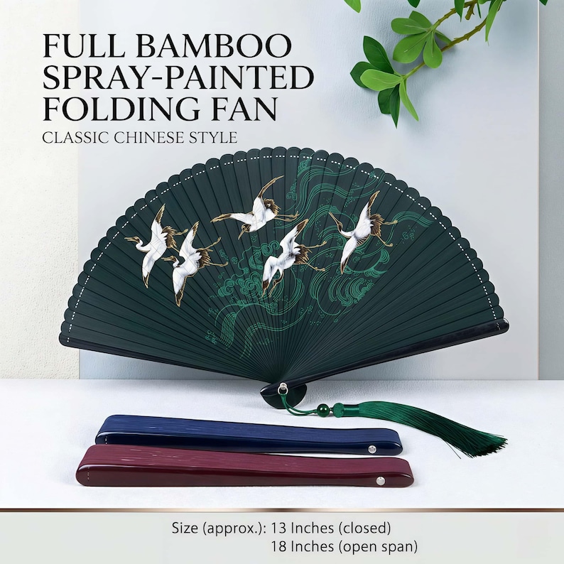 May include: A dark green bamboo folding fan with a crane design, a classic Chinese style. The fan is approximately 33 cm long when closed and 46 cm when open. Includes a green tassel and two wooden fan handles.