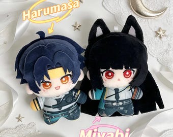 May include: Two plush dolls featuring anime-style designs. The left doll has dark blue hair, orange eyes, and a yellow headband. The right doll has black hair with cat ears, red eyes, and a teal and white outfit. Text labels read Harumasa and Miyabi.