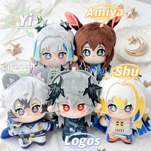 May include: A group of five plush dolls with anime-style features. Each doll has unique hair and clothing, with names like "Yi," "Amiya," "SilverAsh," and "Shu" above them. The word "Logos" is also visible. The dolls are set against a soft, white background.