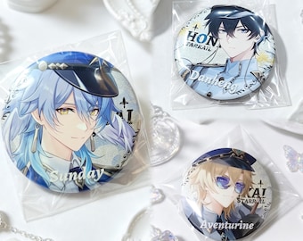 May include: Three circular pin-back buttons featuring anime-style character illustrations. One large button depicts a character named Sunday with light blue hair. Two smaller buttons feature characters named Danheng and Aventurine with text.