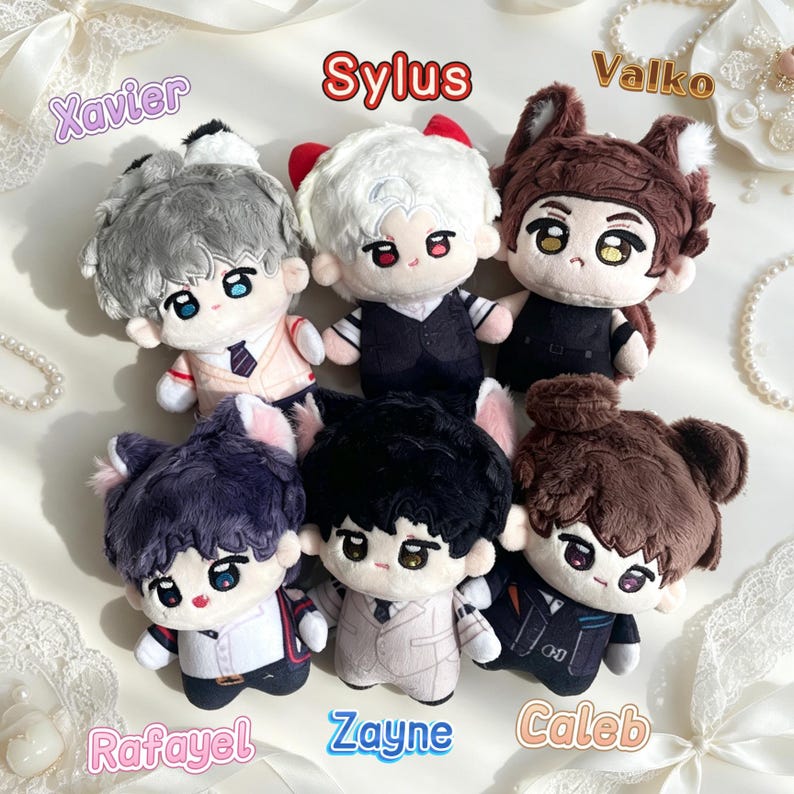 May include: Six plush dolls with embroidered facial features and soft hair textures. The dolls are labeled with the names Xavier, Sylus, Valko, Rafayel, Zayne, and Caleb. Each doll wears distinct clothing, including vests, suits, and shirts, with some featuring animal-like ears.