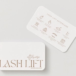 May include: Two white, rounded-corner cards with brown text and illustrations. One card reads "LASH LIFT" with "aftercare" above it. The other card has "LASH LIFT AFTERCARE" at the top, with icons and text detailing aftercare instructions.
