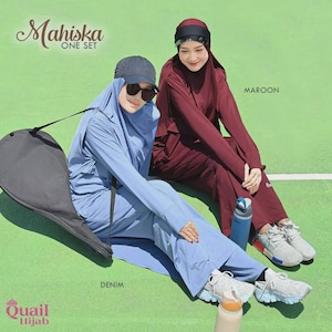 May include: Two Mahiska one set outfits in denim blue and maroon. Each set includes a long-sleeved tunic, matching pants, and a coordinating hijab. The denim set is worn with a dark baseball cap and sunglasses, while the maroon set features a head covering.