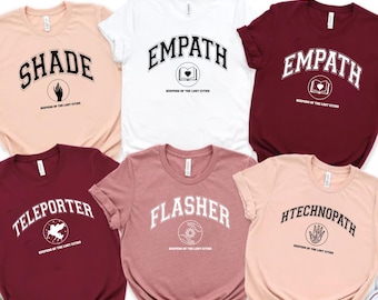 Camiseta unisex con capucha y símbolos del Guardián de las Ciudades Perdidas, equipo foster-keefe, camiseta de Foxfire Academy, camiseta Kotlc, camiseta Bookish.