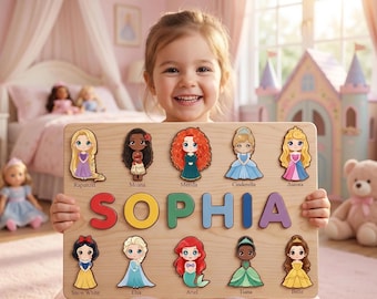 May include: A rectangular wooden puzzle board featuring the name SOPHIA in large, colourful, raised letters. The board includes ten cartoon-style princess figures, each labelled with their name: Rapunzel, Moana, Merida, Cinderella, Aurora, Snow White, Elsa, Ariel, Tiana, and Belle.