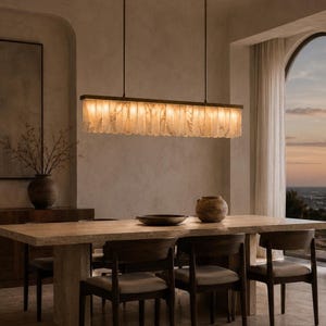 Wabi sabi alabaster dining room chandelier, long narrow stone fins, airy windowed banquet setting