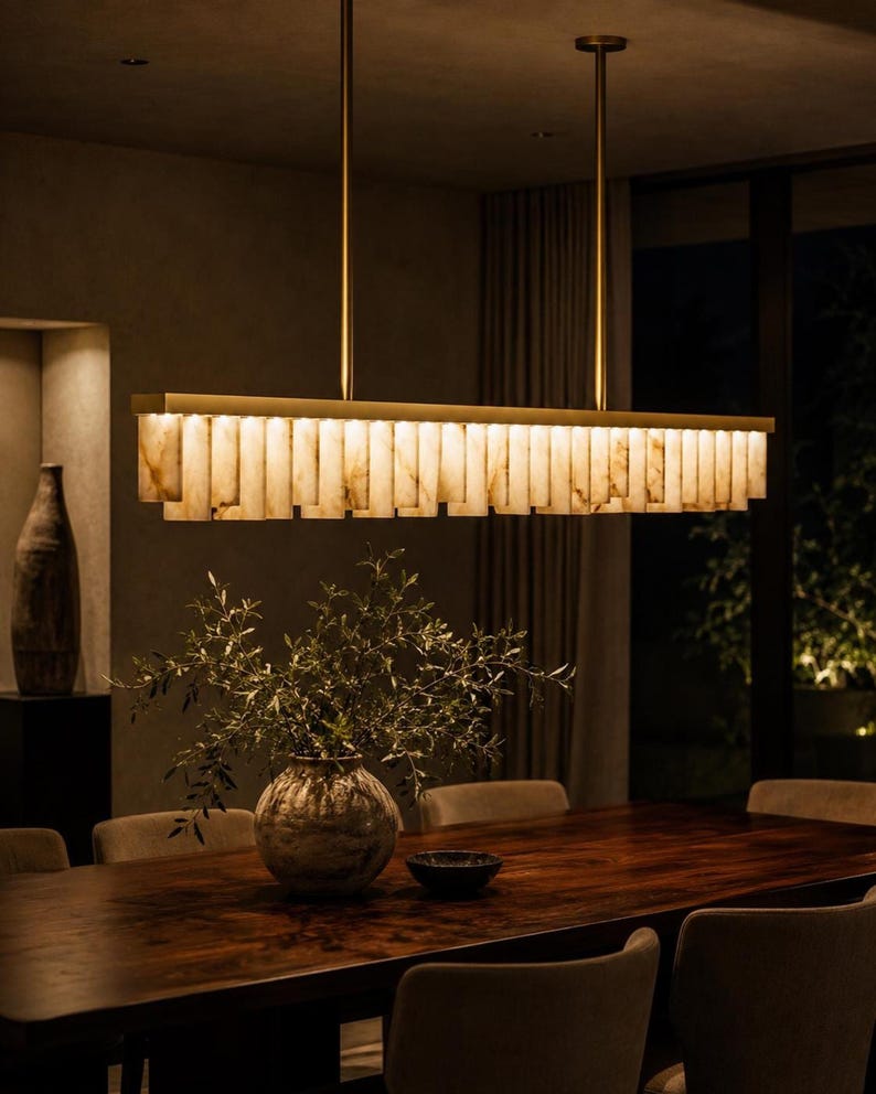 XL linear chandelier over large wood table, alabaster dining room light with luxe brass finish