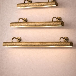 Three lengths of solid brass picture light stacked, hand hammered brass picture light size options