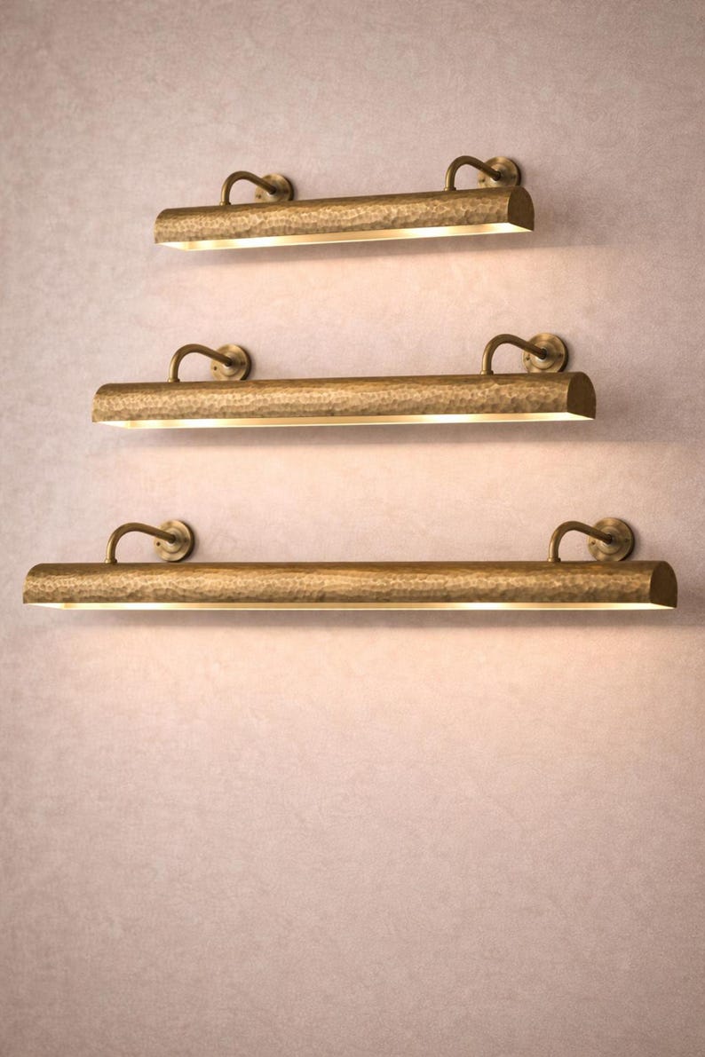 Three lengths of solid brass picture light stacked, hand hammered brass picture light size options
