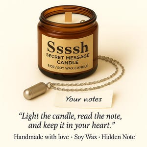 May include: A brown glass jar candle labeled "Ssssh! Secret Message Candle." The candle includes a hidden note and a silver-colored chain with a small capsule. The candle is 8 oz and made with soy wax.