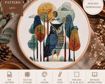 May include: A cross-stitch pattern in a wooden embroidery hoop featuring a stylized owl surrounded by colorful trees in shades of blue, yellow, and orange. The design includes text labels for PDF pattern, instant download, and stitch details.